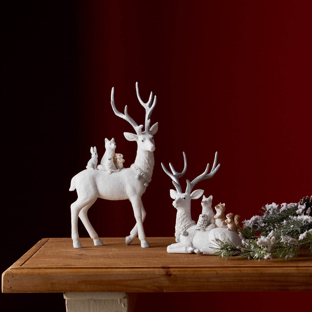 White Reindeer with small animals on back